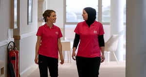 E4 nurses talking through corridor talking to eachother