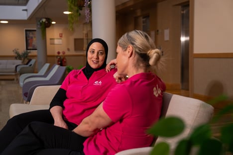 Two E4 nurses on sofa talking to eachother 2