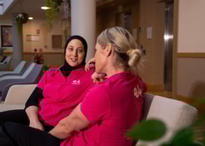 Two E4 nurses on sofa talking to eachother