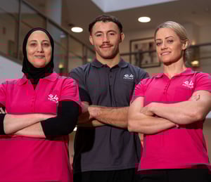 Two female and one male E4 nurse in uniform arms folded looking to camera 2
