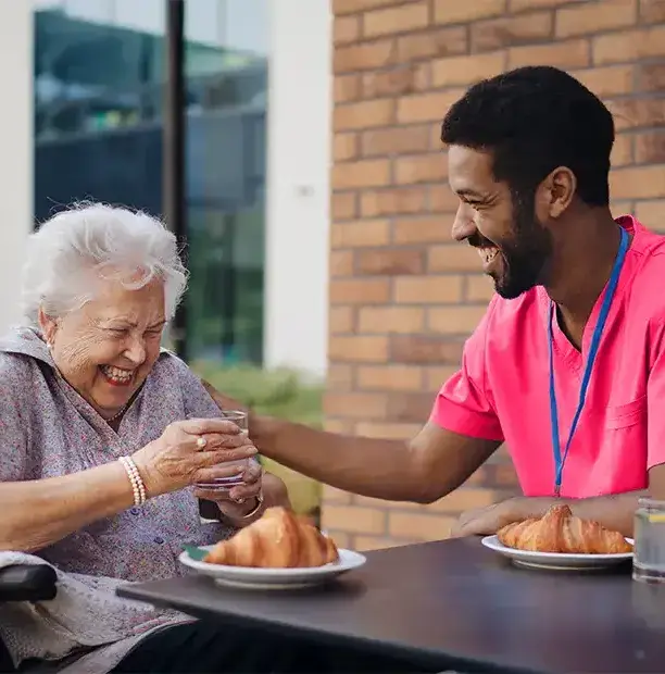 caregiver-having-breakfast-with-his-client-at-cafe-2024-10-18-10-00-12-utc copy-1